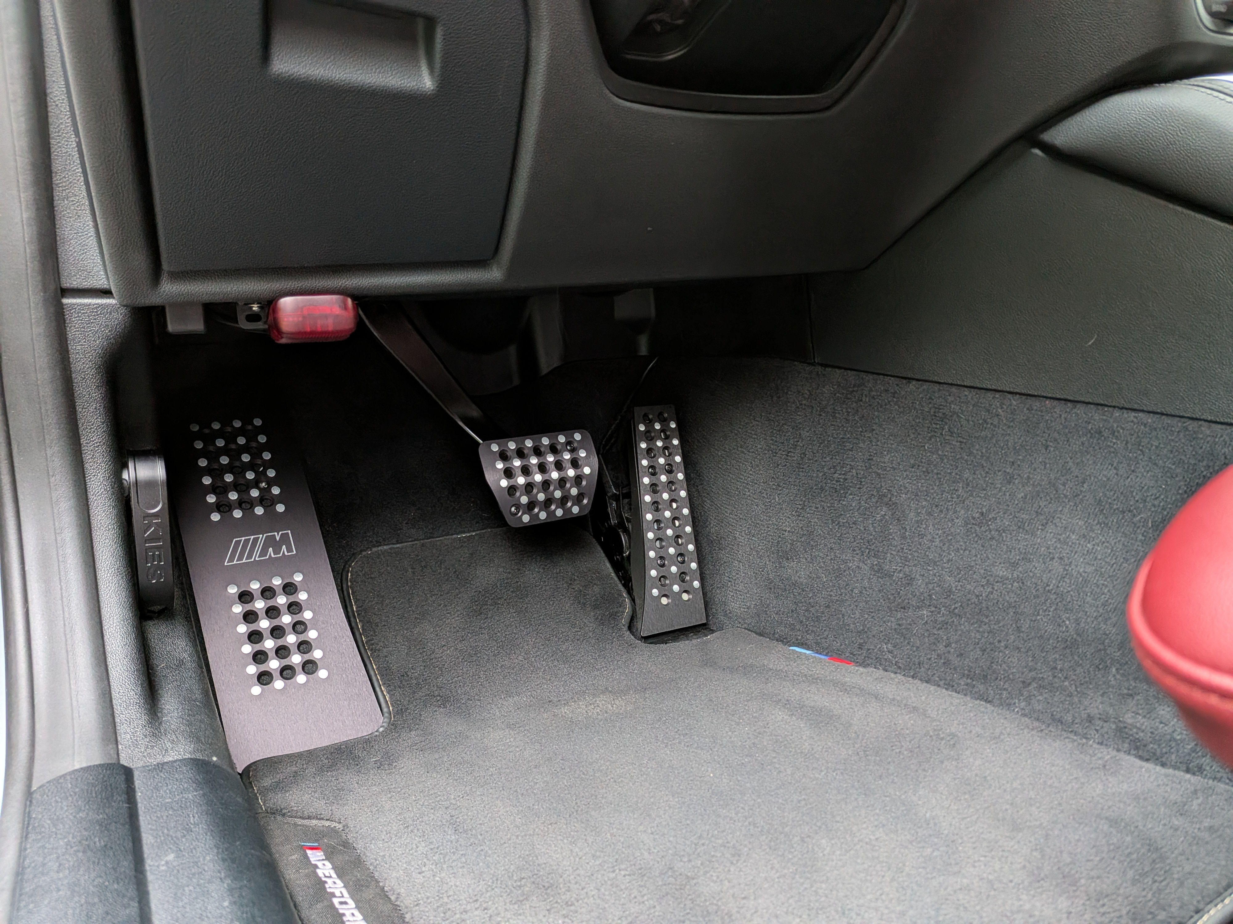 DV-001 interior — M Performance pedals and M floor mats