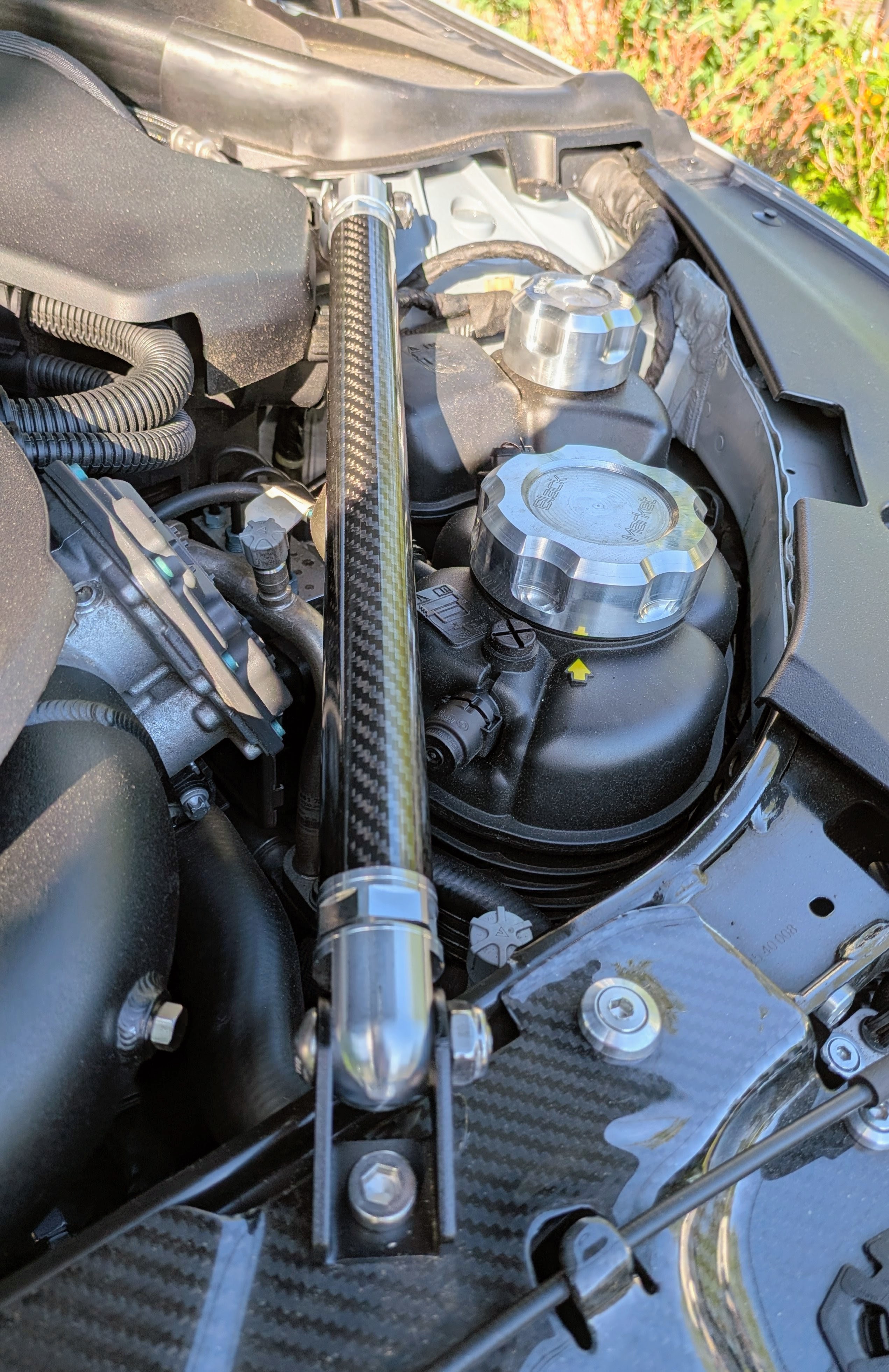DV-001 engine bay — carbon strut brace detail